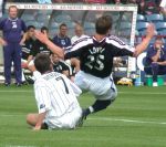 Dundee v Pars 17th August 2003. Barry Nicholson going in whole-heartedly.