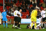 Pars v Celtic 10th December 2006. Clash of heads with Craig Thomson waving away the Pars protests.