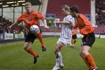 Pars v Dundee Utd. 25th February 2006. Noel Hunt v Garry Kenneth (left) and Lee Mair