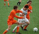 Pars v Dundee Utd. 17th April 2004. Gary Mason sandwiched